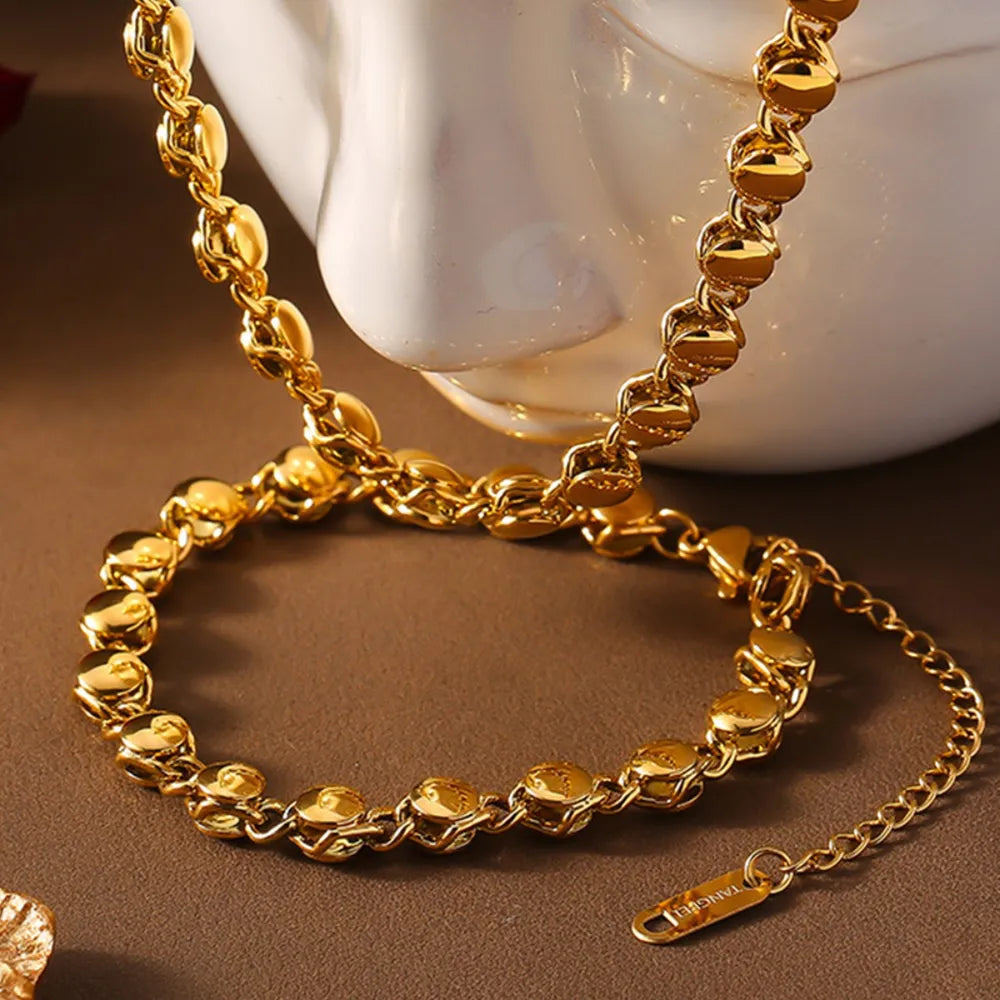 Gold 18K gold-plated bracelet with sculpted orb chain links and a lobster clasp.