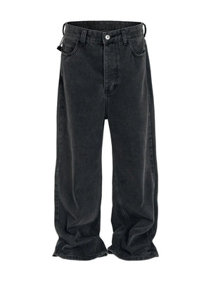 Baggy dark wash denim jeans with a sculpted hemline and casual fit.
