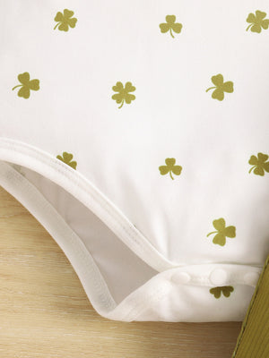 White baby bodysuit with clover print in clover green, snap closure detail