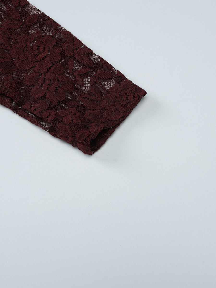 Sheer lace blouse in burgundy with long sleeves and floral pattern detail.