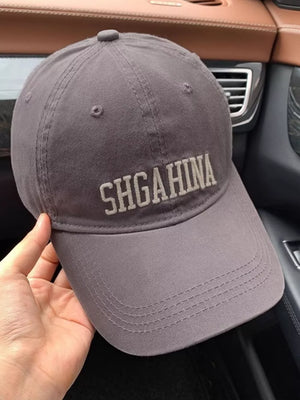 Grey cotton baseball cap with mirrored letter embroidery and curved brim.