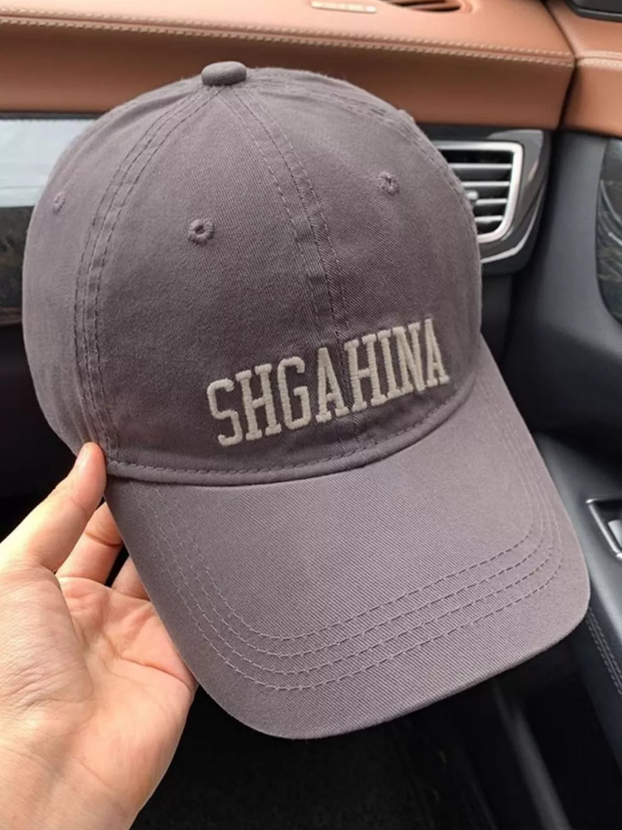 Grey cotton baseball cap with mirrored letter embroidery and curved brim.