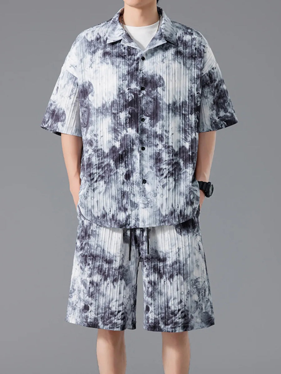 Men's tie-dye pleated casual set in dark navy with short sleeves and drawstring shorts.