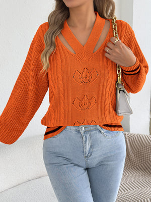 pullover sweater in bright orange with cable knit and cutout