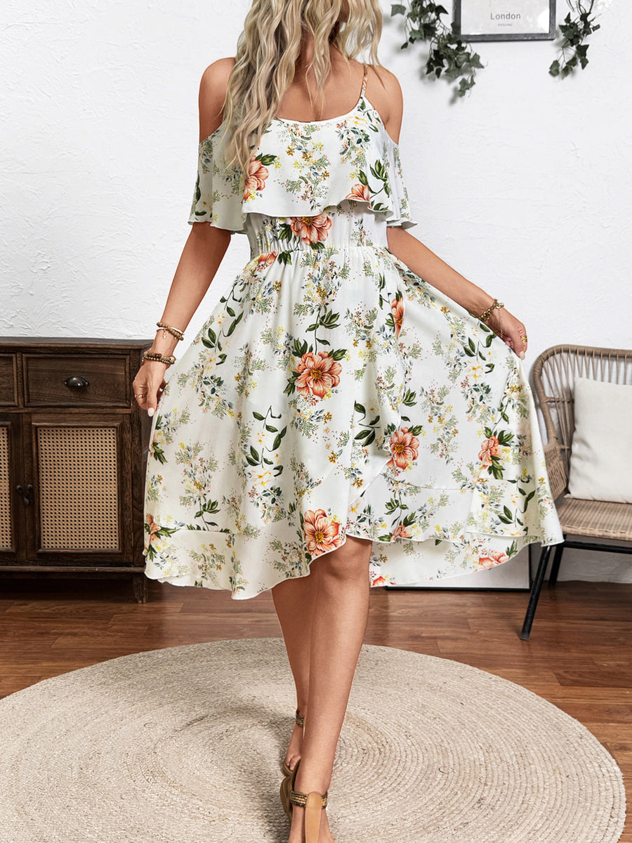 Floral print cold shoulder dress with ruffled overlay and smocked waist.