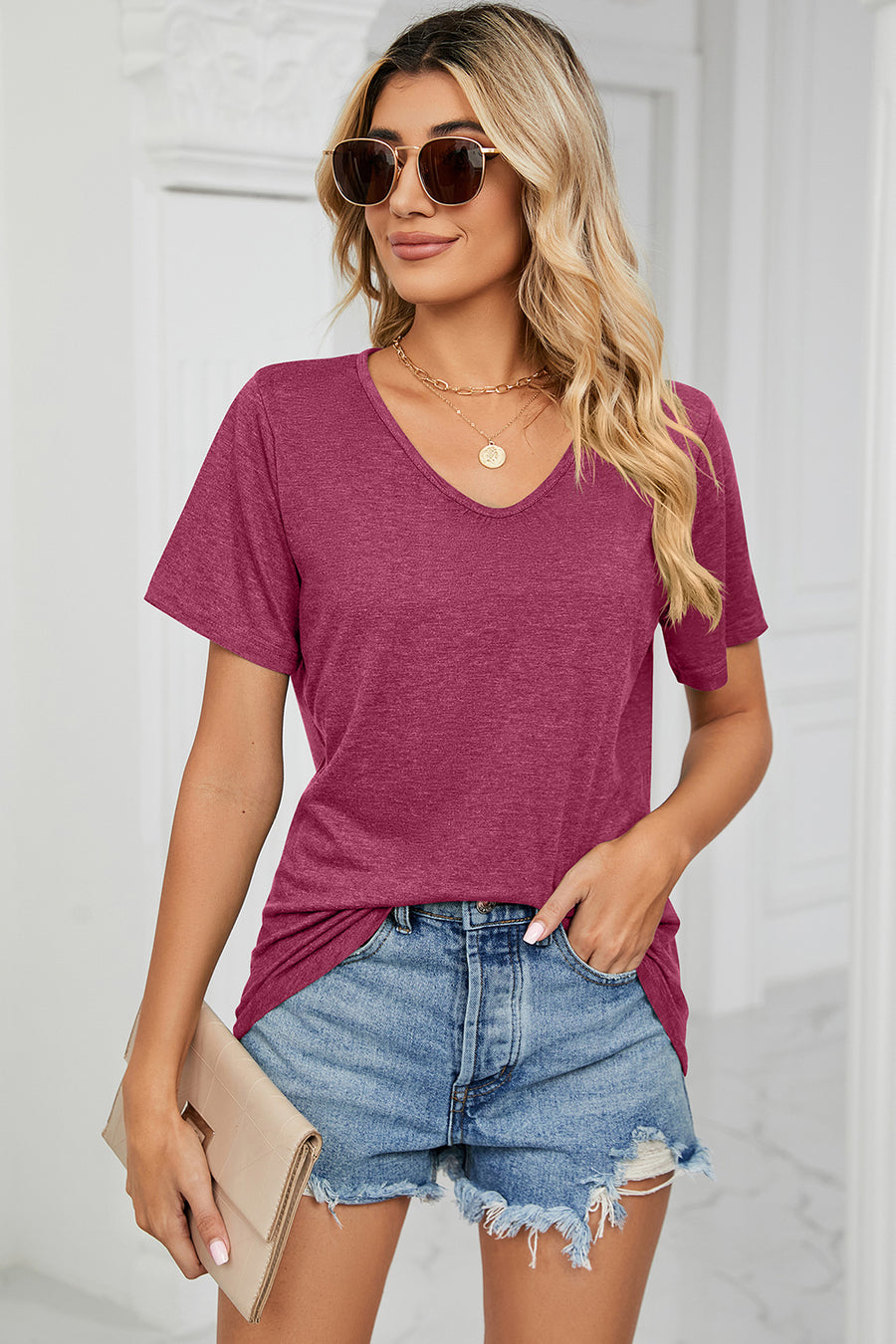 Heathered v-neck t-shirt in magenta with short sleeves and a relaxed fit.