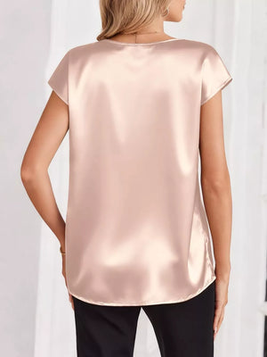 Champagne satin V-neck blouse with short sleeves, a lustrous finish, and a relaxed fit.