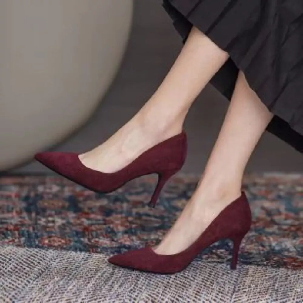 Point toe stiletto pumps in wine red suede with a classic silhouette.