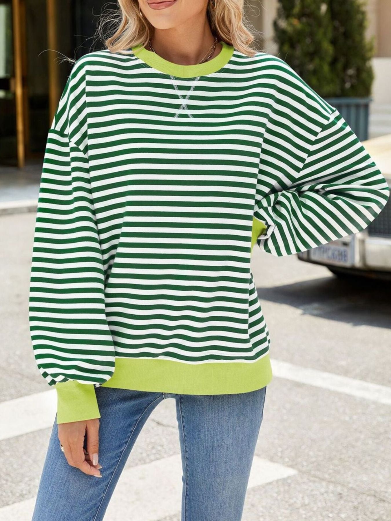 Striped crew neck sweatshirt in Gum Leaf green with white stripes and contrast lime green trim.
