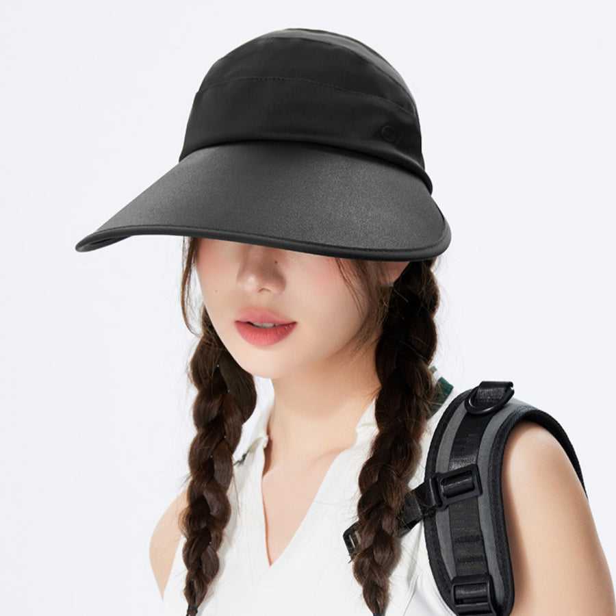 Black wide brim sun visor hat with button detail and adjustable straps.