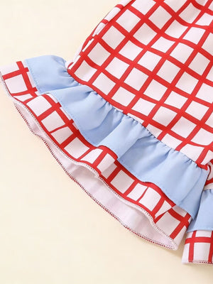 Baby girls' red and white checkered cotton top with blue ruffles and trim.