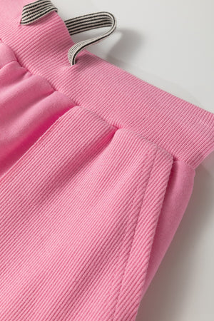Pink cotton loungewear pants with drawstring and ribbed waistband detail