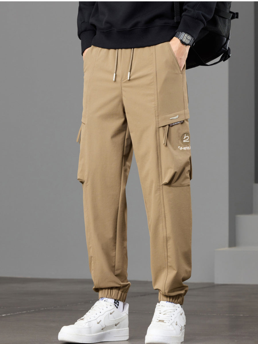 95%polyester,5%spandex Care instructions: Machine wash cold joggers in Black with tapered silhouette