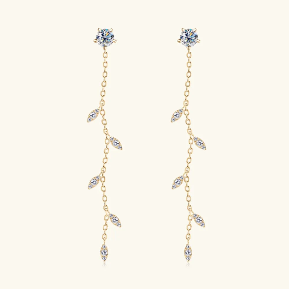 Gold dangling crystal vine earrings with delicate leaf-shaped accents.