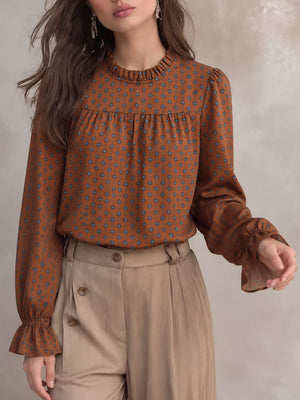 rust blouse with geometric and mock neck