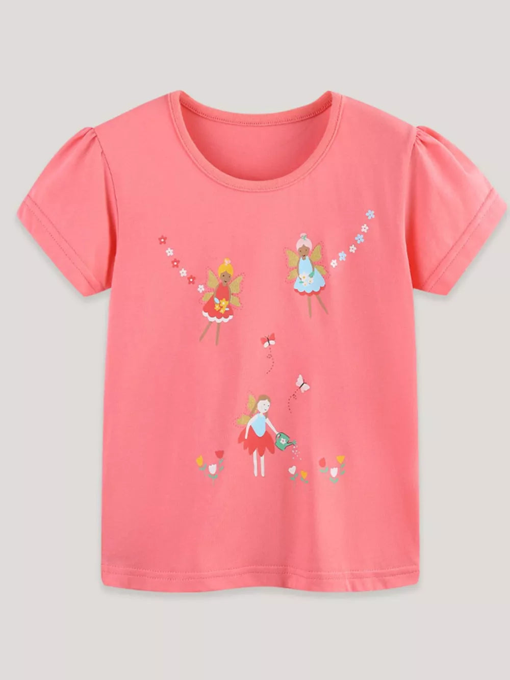 Coral t-shirt with puff sleeves and an enchanted fairy garden print featuring butterflies and flowers.