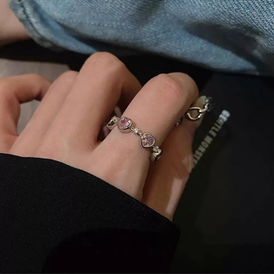 ring in pink with heart motif and heart-shaped zircons
