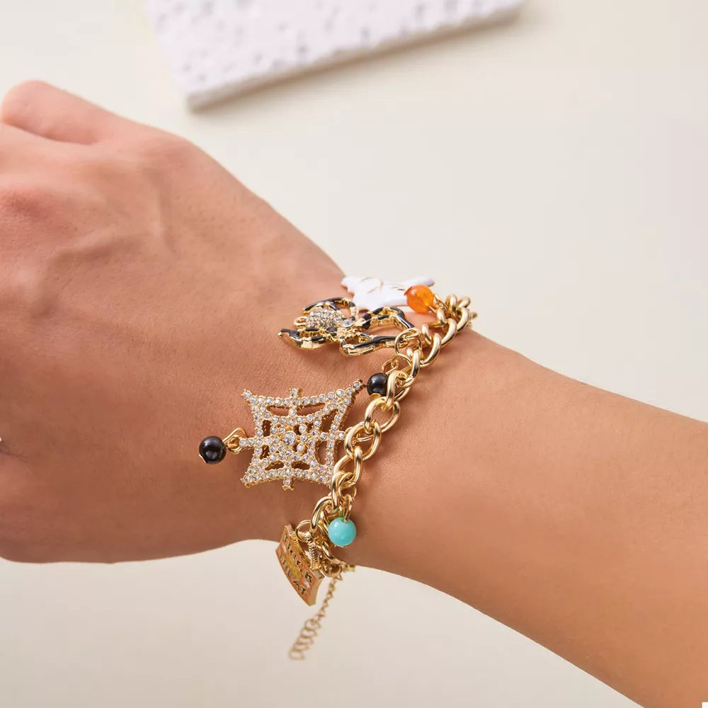 bracelet in gold featuring charm bracelet and straight fit