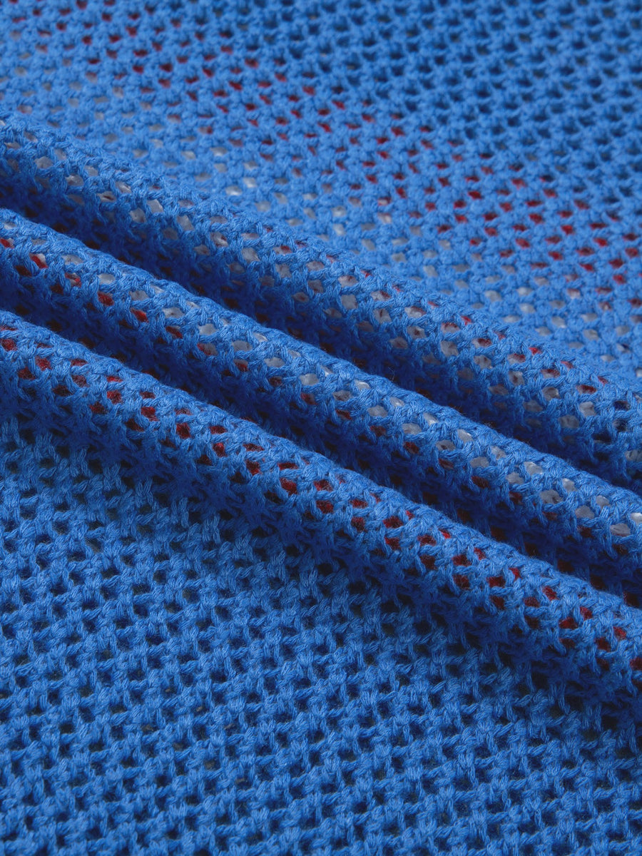 Patriotic flag graphic knit top in blue acrylic with a crew neck and open knit detail.