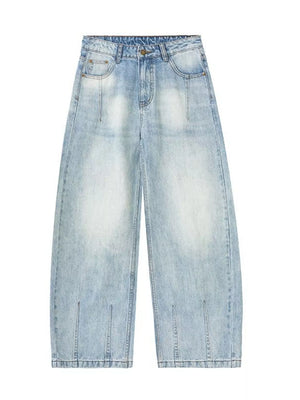 Men's light blue wide-leg stretch jeans with a faded wash and split hem detail.