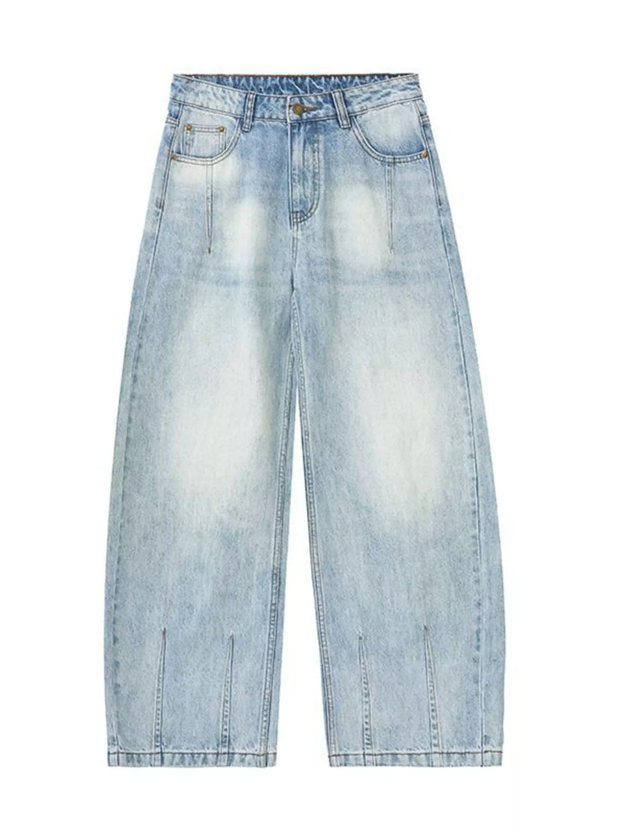 Men's light blue wide-leg stretch jeans with a faded wash and split hem detail.