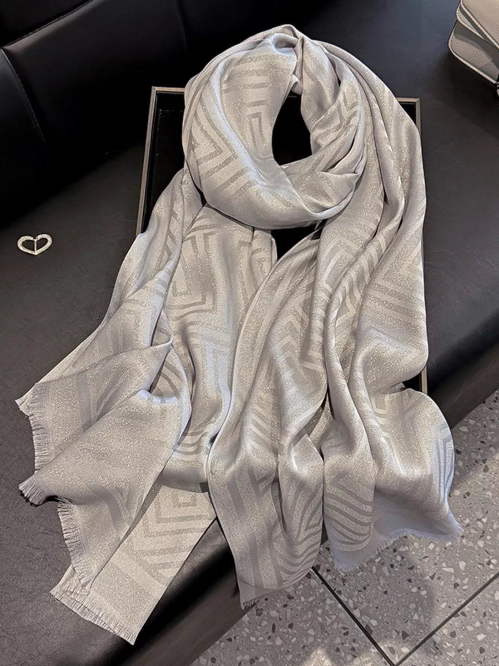 Elegant gray Tencel cotton scarf with geometric pattern and fringe detail
