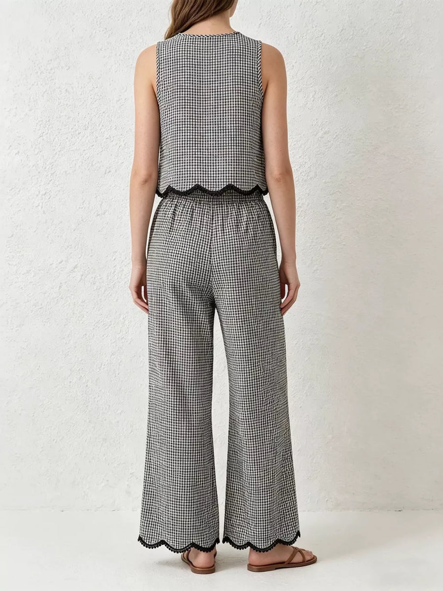 Plaid two-piece set with scalloped trim on sleeveless top and wide-leg pants.