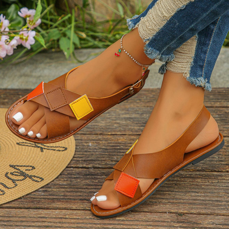 Dark brown ankle strap sandals with colorful patchwork detail and criss-cross straps.