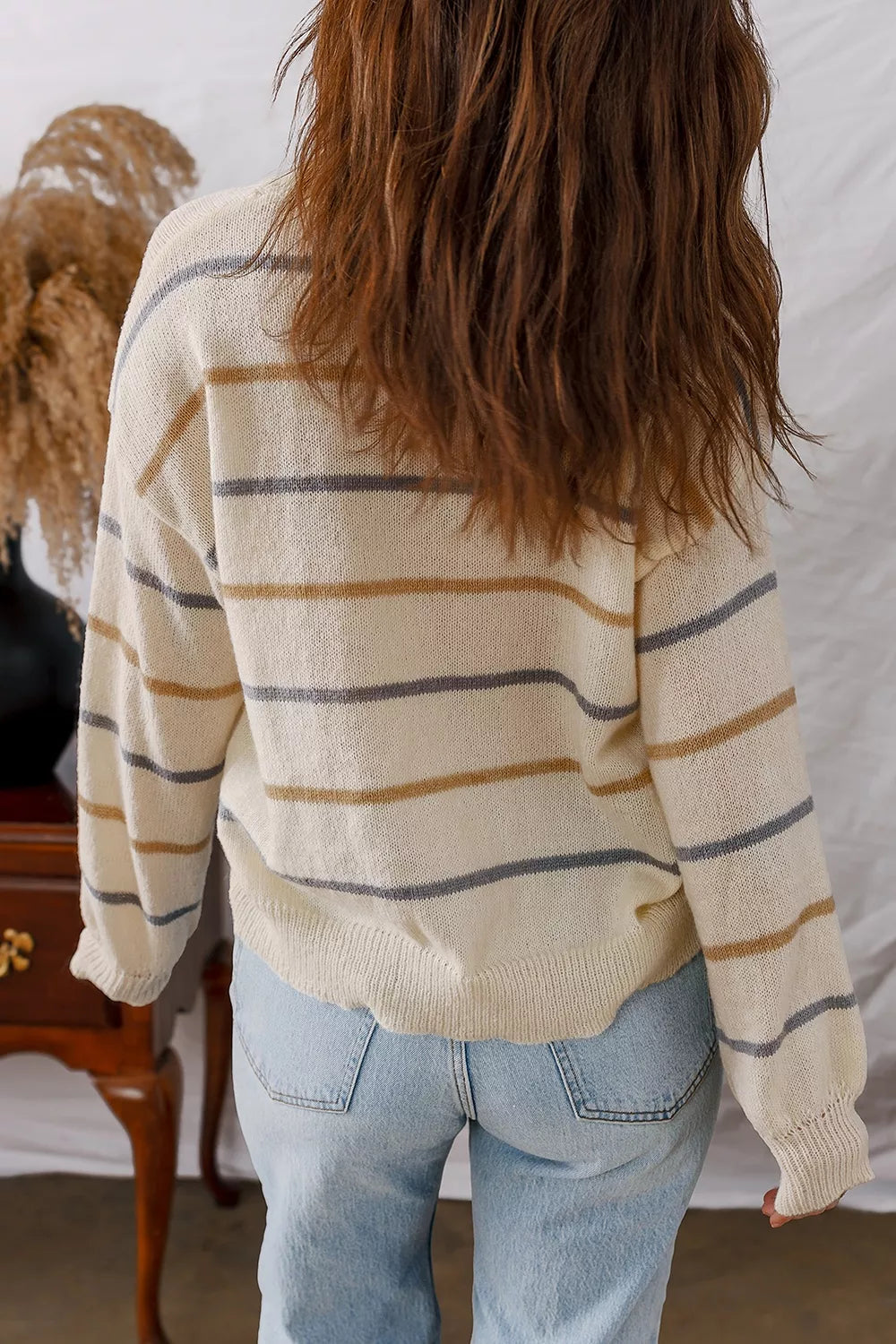 tan cardigan featuring buttoned and striped
