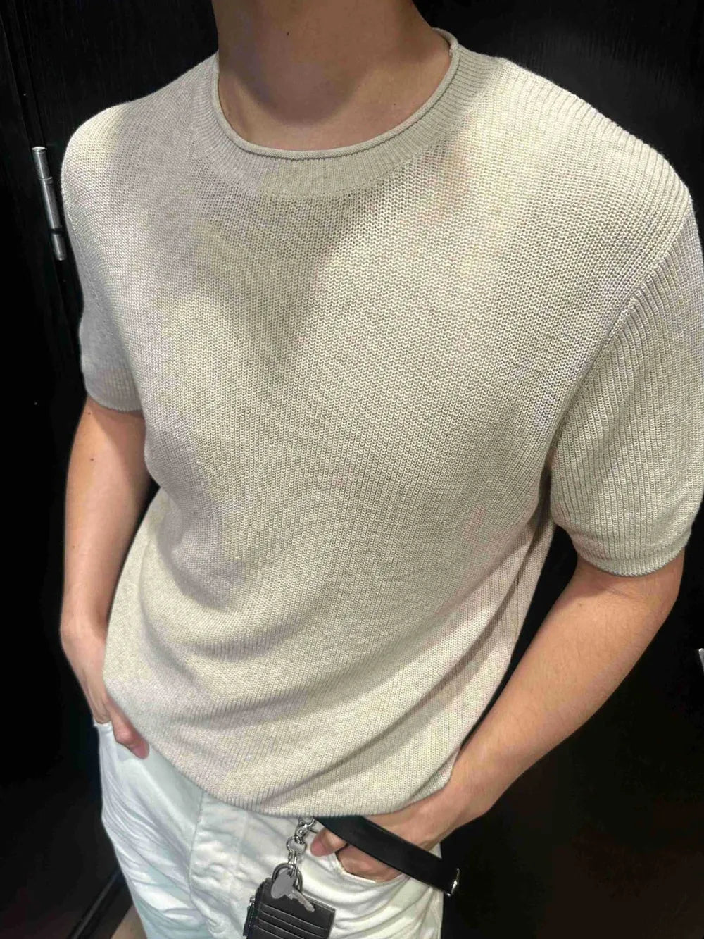 Men's beige short sleeve knit top with crew neck.