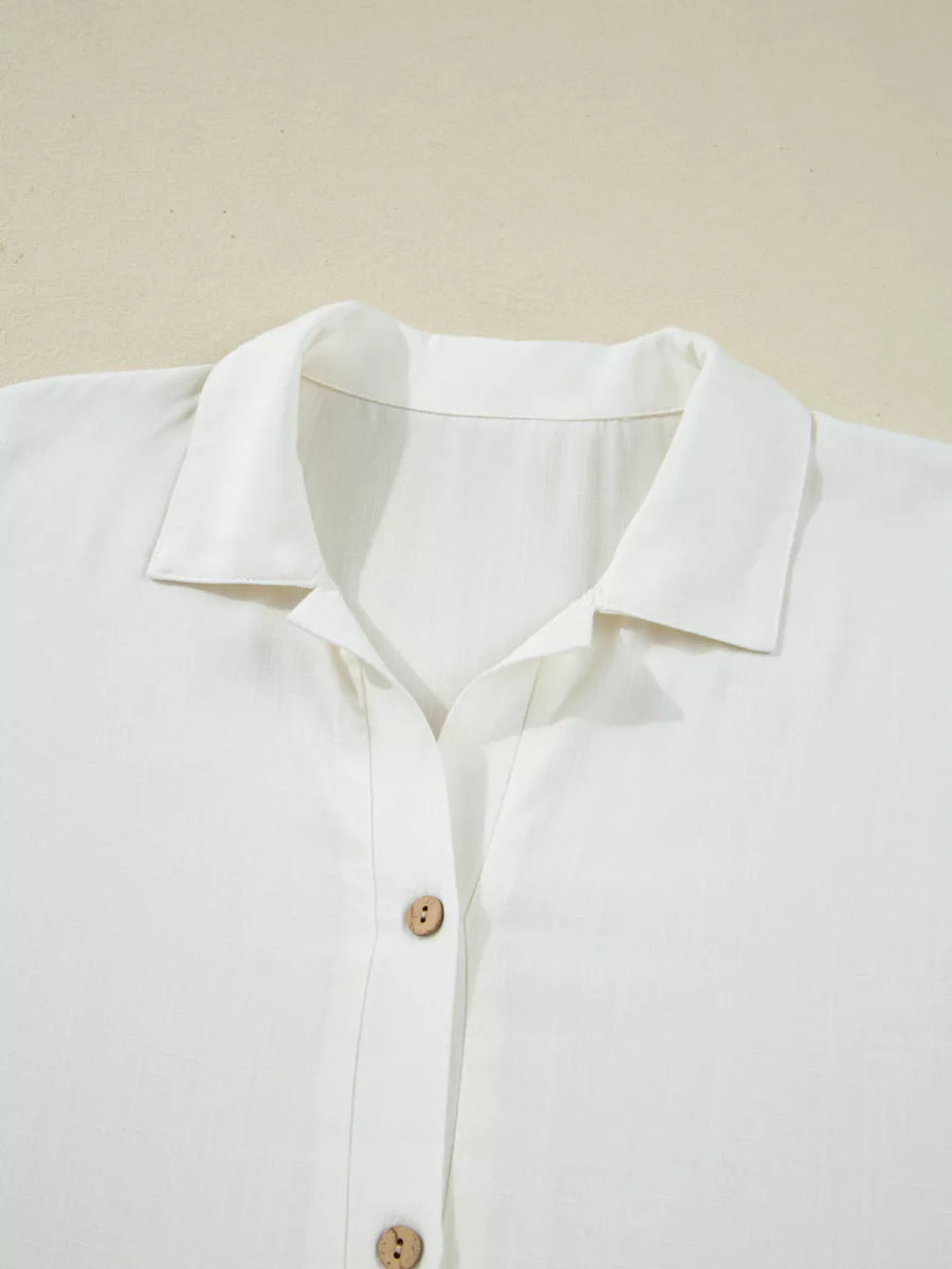 White linen blend button-up shirt with spread collar and wooden buttons