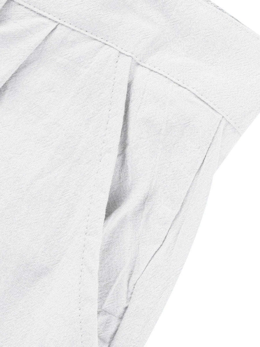 White relaxed fit sweatpants with pleats and pocket detail