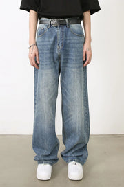 Wide-leg washed denim jeans in medium blue, relaxed fit, with a distressed look.