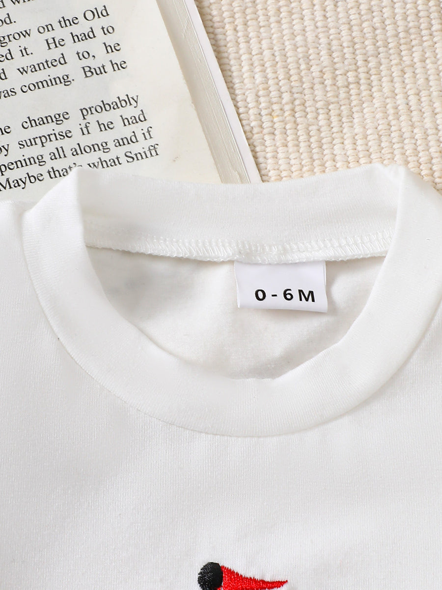 White cotton blend baby tee with sailboat appliqué and size tag