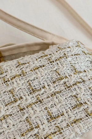 Tweed box bag in ivory with gold metallic threads and a detachable strap.