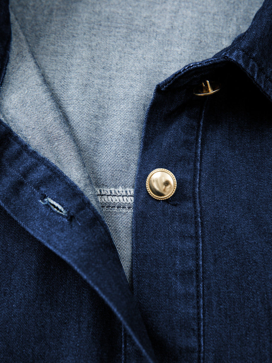 Button-down midi denim dress with gold buttons and a collar detail.