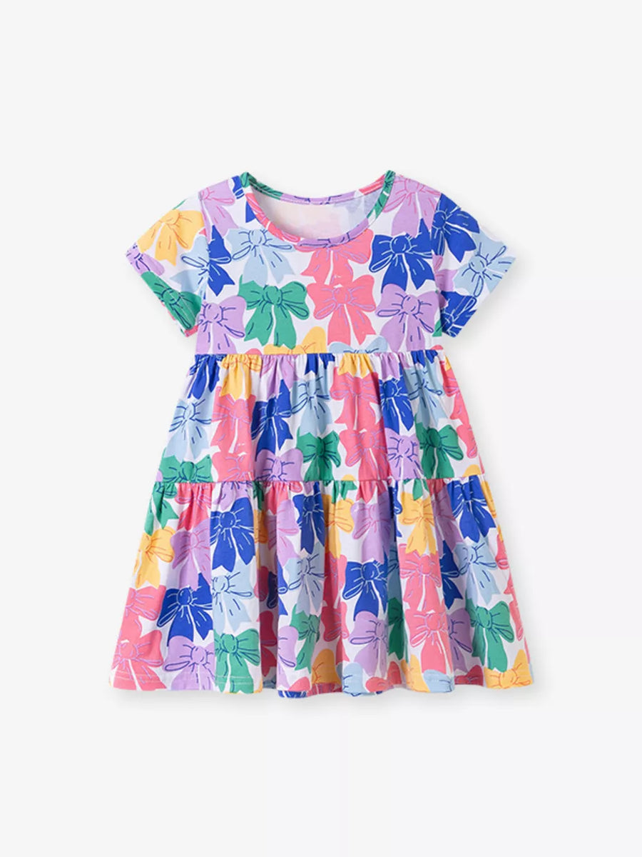 Baby tiered dress with colorful bow print, short sleeves, and round neckline.