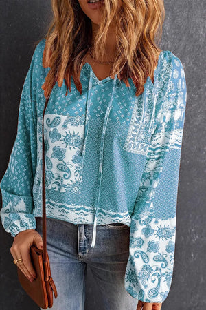 burnt orange blouse with tie-neck and long sleeve