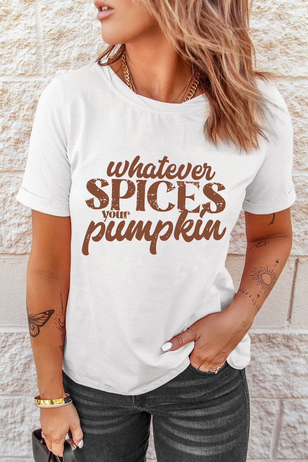 White t-shirt with brown text graphic that says "whatever SPICES your pumpkin
