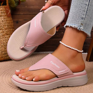 Pink toe post platform sandals with velcro strap and "Fashion" detail.