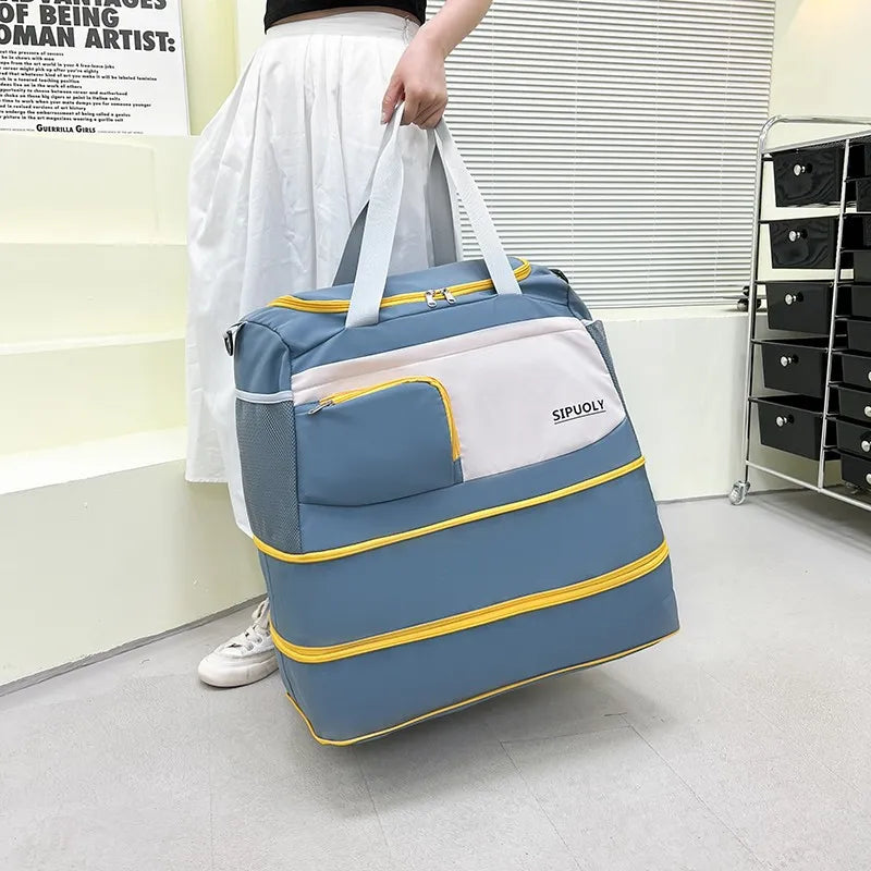 Peacock blue duffel bag with white and yellow accents, mesh side pocket, and zip expansion