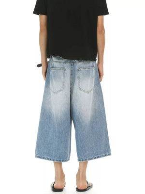 Light blue relaxed fit cropped cotton jeans with a faded wash.