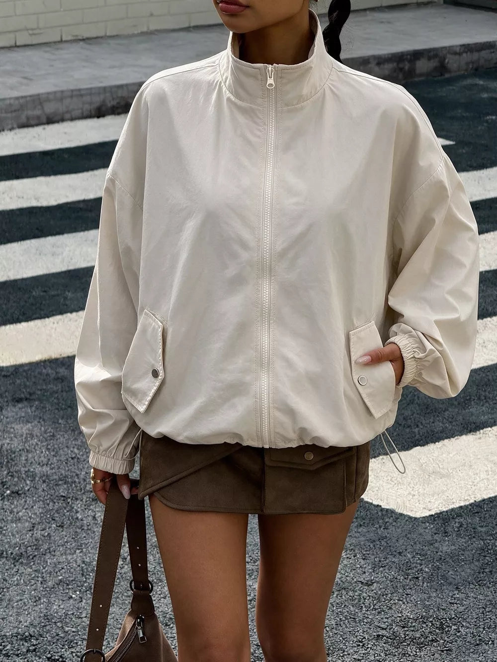 windbreaker in cream featuring drawstring and relaxed fit