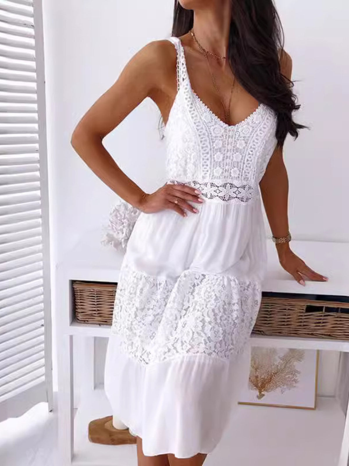 White lace trim V-neck tiered cami dress with adjustable straps and a flowy skirt.