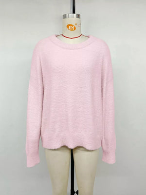 Pink fuzzy knit sweater with crew neck and long sleeves
