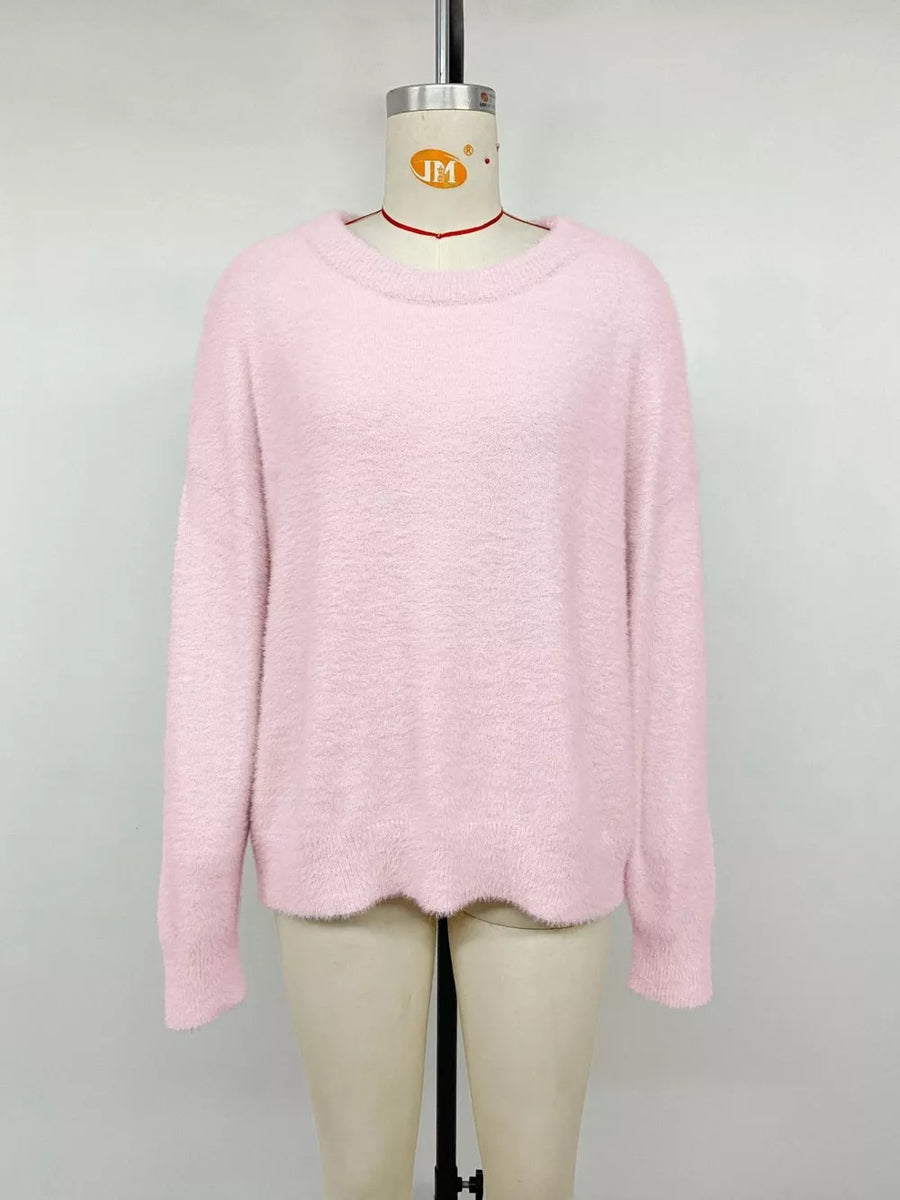 Pink fuzzy knit sweater with crew neck and long sleeves
