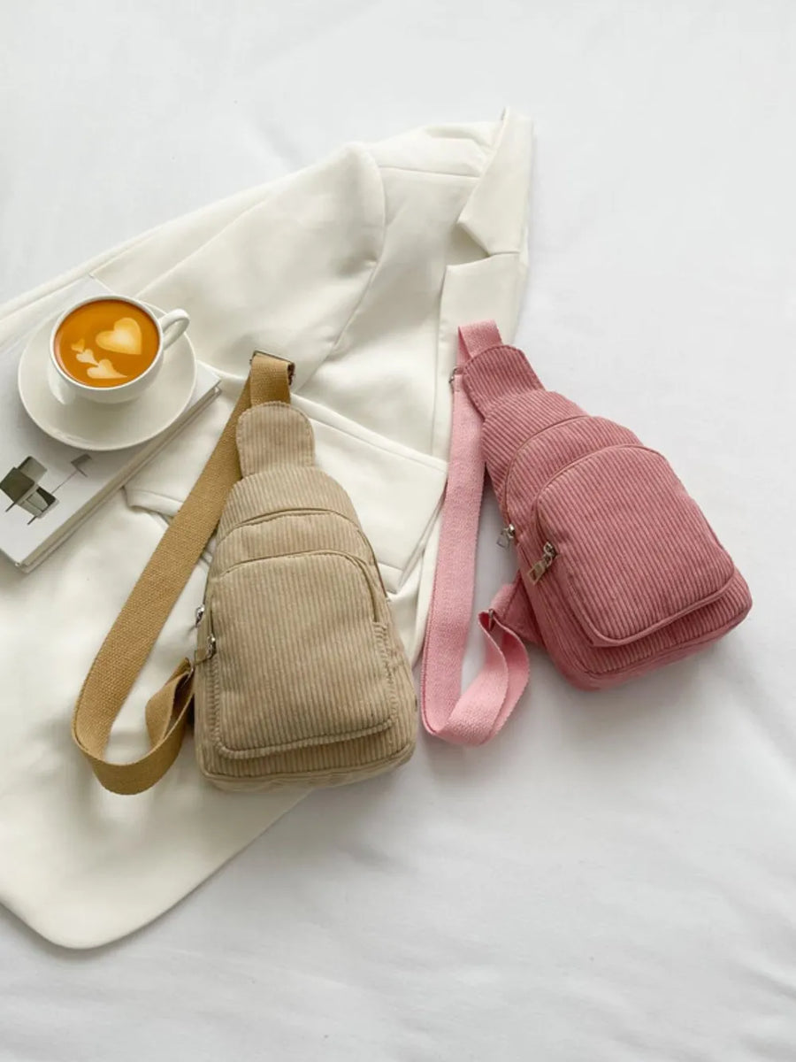 Corduroy sling bags in Khaki and Pink with zip pockets and adjustable straps.