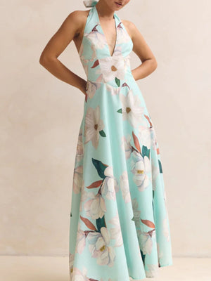 Light blue floral halter neck maxi dress with a deep V-neckline and A-line skirt.