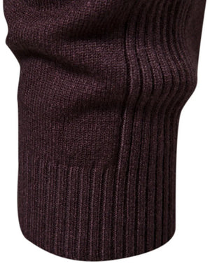 Plum purple ribbed sweater with mock neck detail and sculpted shoulder.