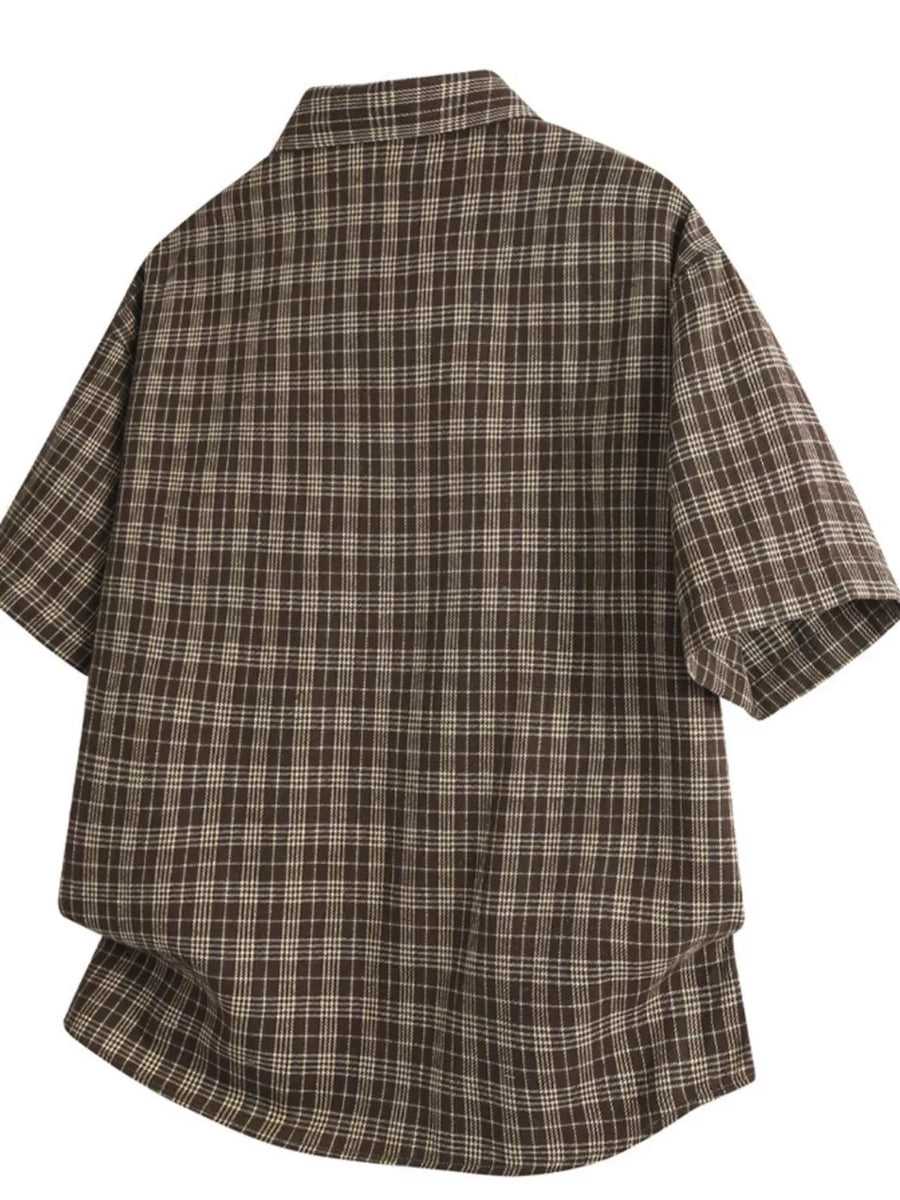 Classic oversized plaid button-front shirt in chocolate with short sleeves.